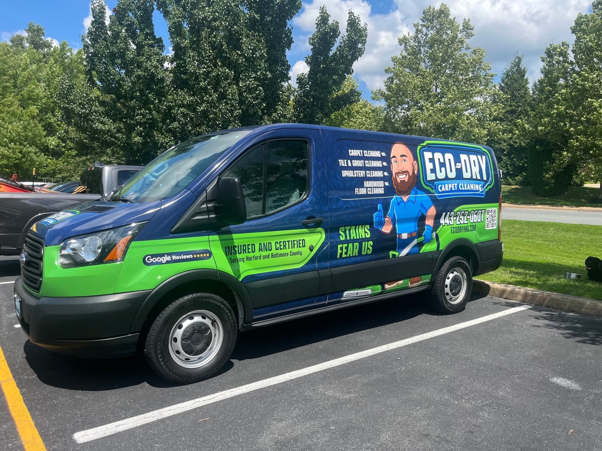 Eco-Dry blue and green wrapped carpet cleaning van