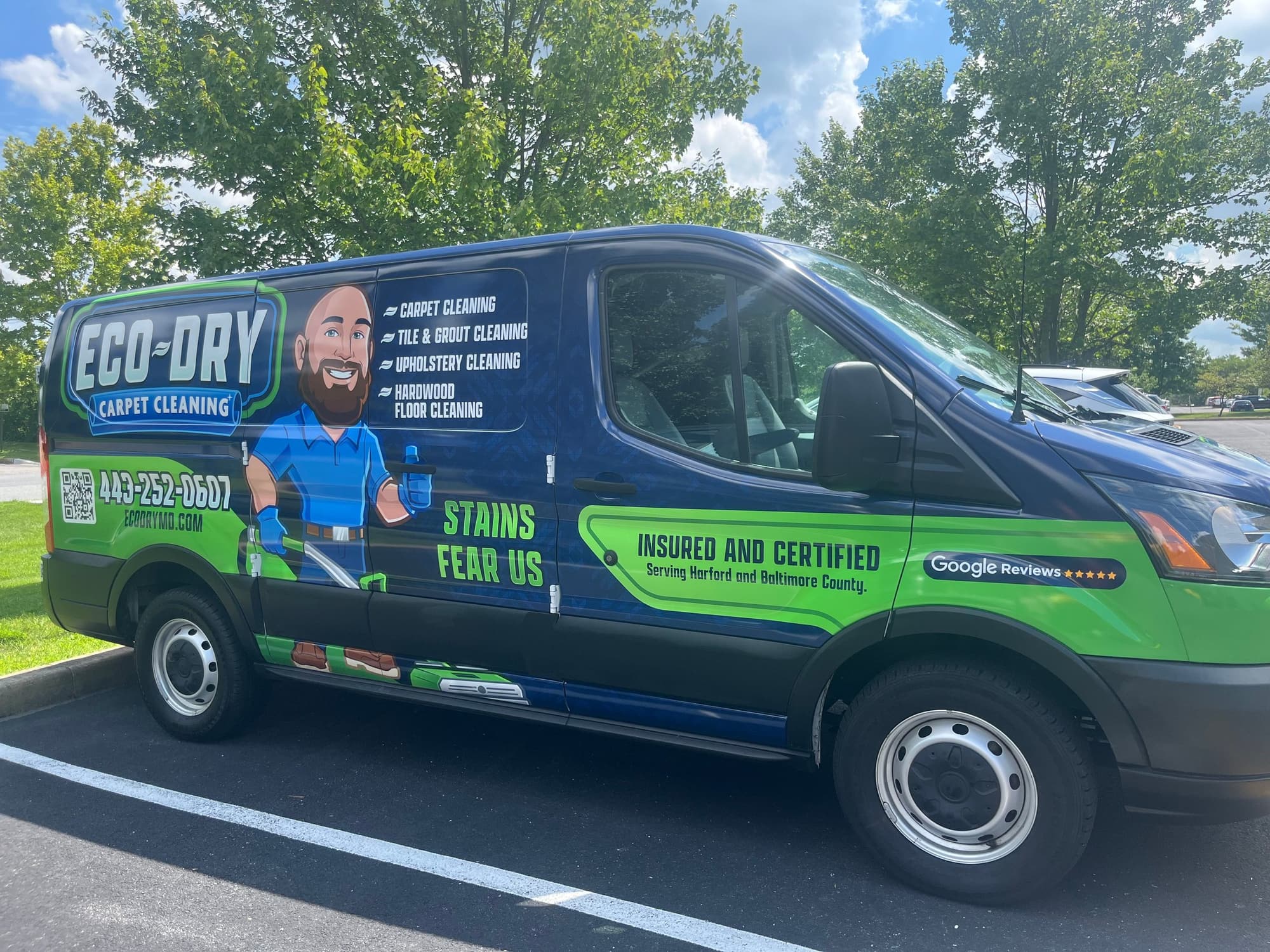 Close view of the Eco-Dry wrapped van with service branding and equipment