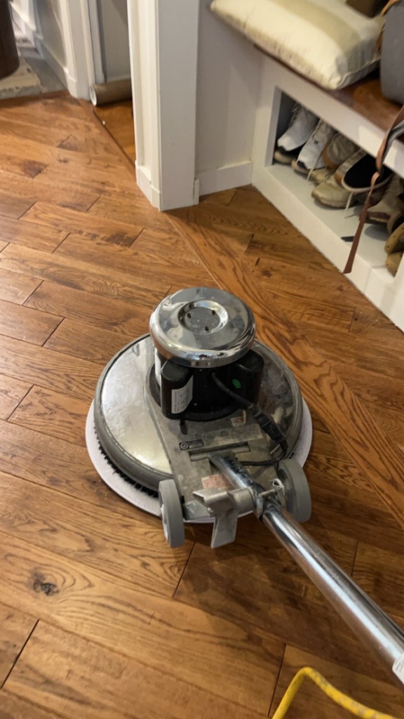 Hardwood floor cleaning on site in a Baltimore area home