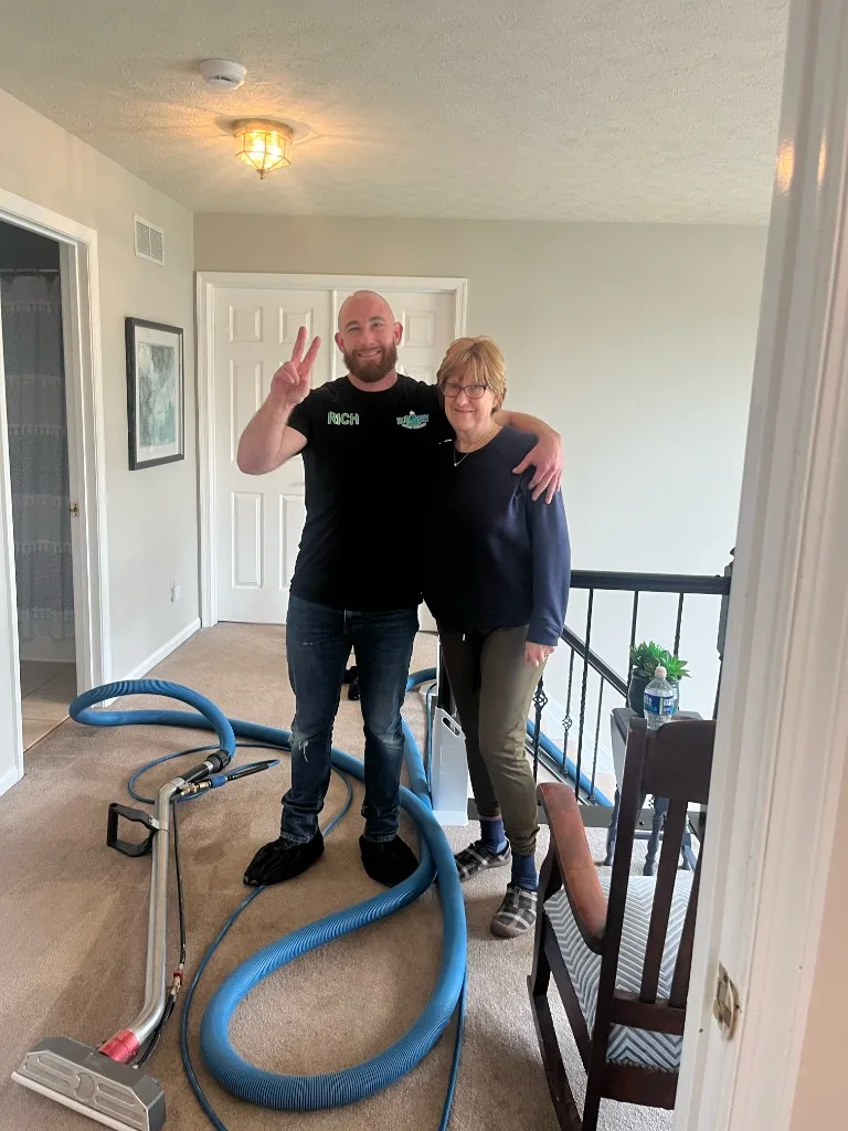 Rich Tobin with a happy customer after carpet cleaning