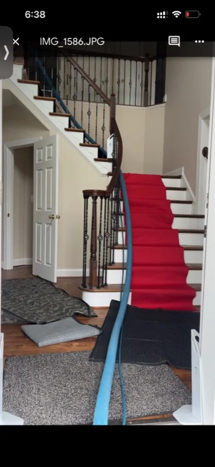 Red stair runner and floor protection during an Eco-Dry carpet cleaning visit