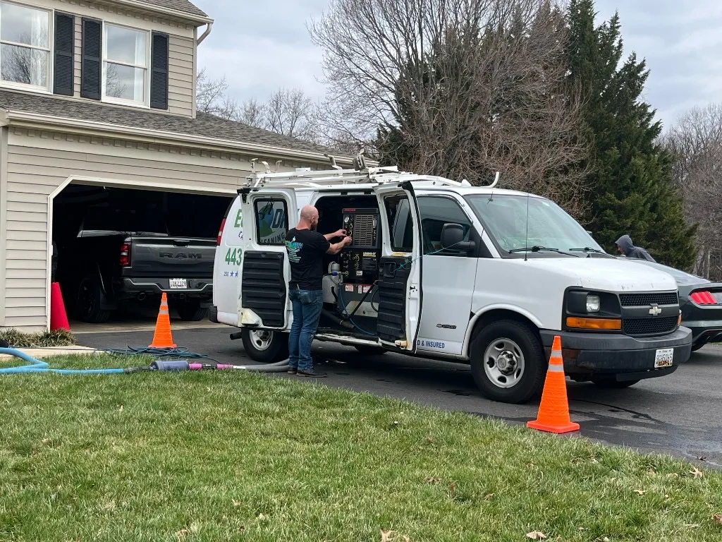 Eco-Dry technician with truck mounted equipment at a customer home