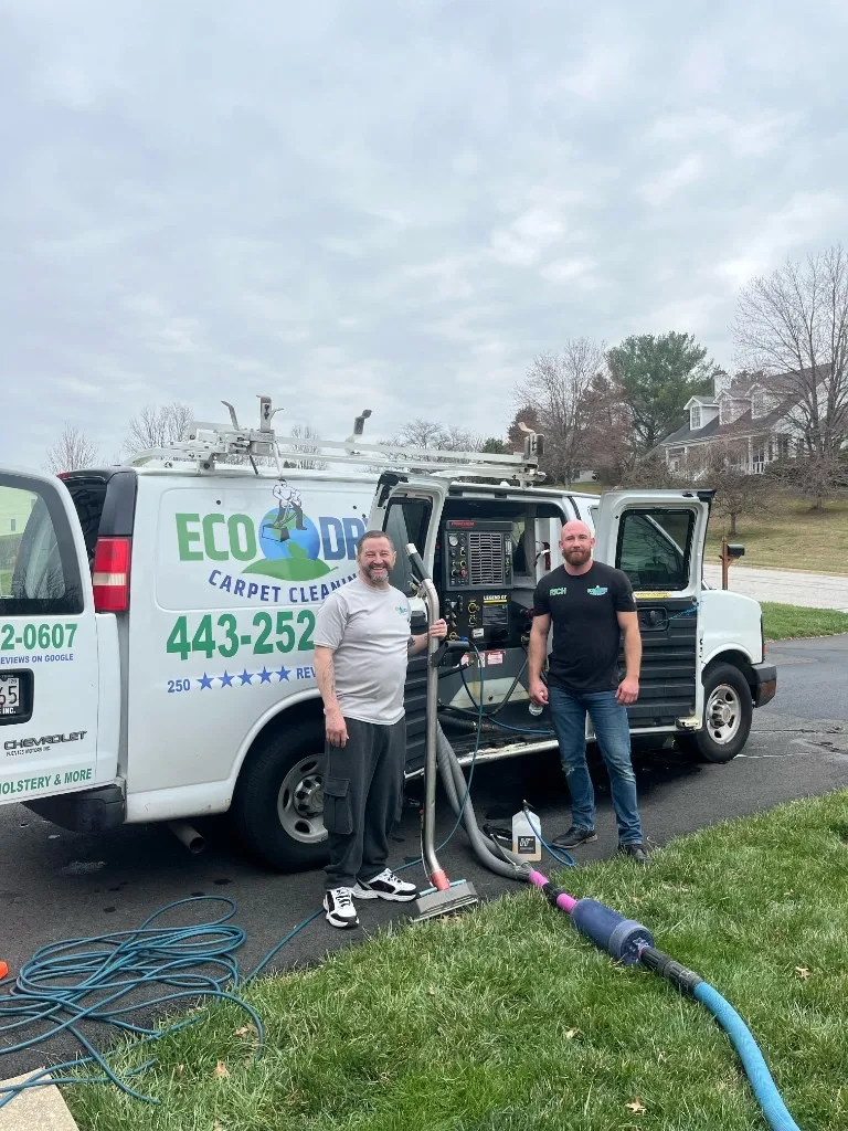 Eco-Dry team with branded van and truck-mounted cleaning equipment