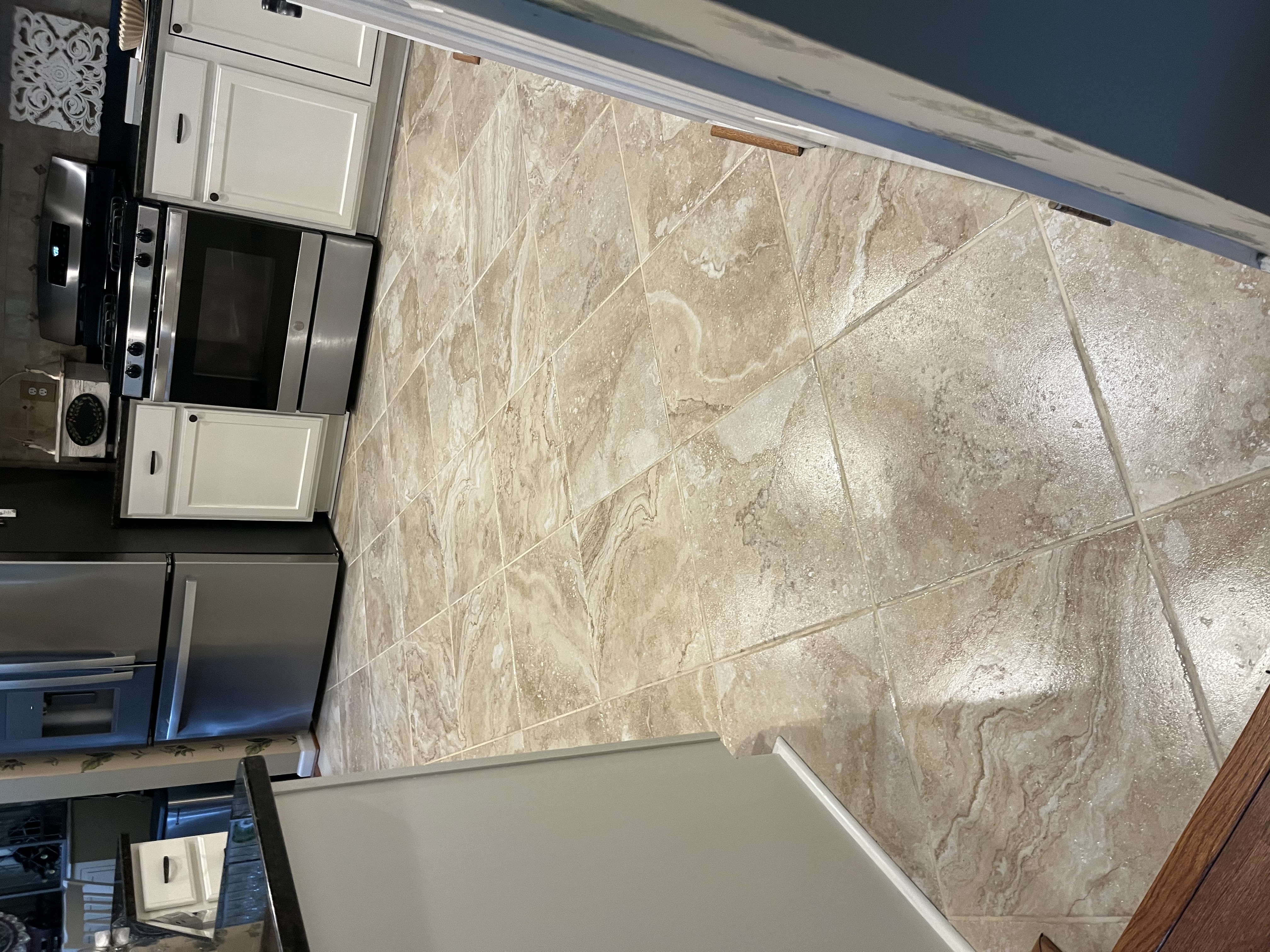 Eco-Dry technician cleaning tile and grout in a Baltimore area home